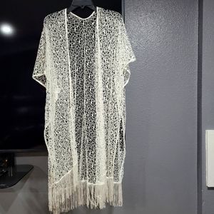 Very Classy white Shaw with  tassels at bottom.  One size fits all. Never worn.